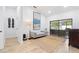 Open living space with a large rug, modern couch, and sliding doors to the outside at 2556 Arborwood Dr, Valrico, FL 33596