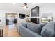 Bright living room with a modern fireplace, comfortable seating, and a sliding glass door leading to an outdoor space at 2556 Arborwood Dr, Valrico, FL 33596