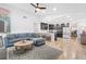 Open-concept living room with a modern kitchen, comfortable seating, and stylish decor creating an inviting atmosphere at 2556 Arborwood Dr, Valrico, FL 33596