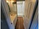 Bathroom features a white vanity and shower with tiled walls at 8035 Robin Rd, Seminole, FL 33777