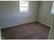 Neutral bedroom featuring clean lines and a single window at 8035 Robin Rd, Seminole, FL 33777