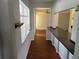 Interior hallway with hardwood floors leading into another room at 8035 Robin Rd, Seminole, FL 33777