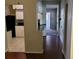 View of hallway with hardwood floors connected to a kitchen at 8035 Robin Rd, Seminole, FL 33777