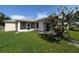 Exterior backyard of the home with screened in patio at 1140 Belmar Ave, Port Charlotte, FL 33948