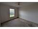 Bedroom with large window and ceiling fan at 1140 Belmar Ave, Port Charlotte, FL 33948