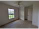 Bedroom with a closet and entry door at 1140 Belmar Ave, Port Charlotte, FL 33948