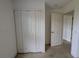 A closet and doorway are featured in this bedroom at 1140 Belmar Ave, Port Charlotte, FL 33948