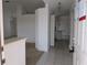 View of entryway with tile flooring, showcasing an open layout leading to the kitchen and other rooms at 1140 Belmar Ave, Port Charlotte, FL 33948