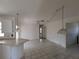 Spacious kitchen with eat-in counter, providing seating and open access to adjacent room at 1140 Belmar Ave, Port Charlotte, FL 33948