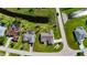 A peaceful neighborhood featuring well-maintained homes with mature landscaping along canal waterways at 142 Broadmoor Ln, Rotonda West, FL 33947