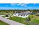 Aerial view of neighborhood shows well-maintained homes and lush landscaping at 142 Broadmoor Ln, Rotonda West, FL 33947