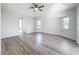 A spacious room with a ceiling fan and wood-look flooring, offering a clean and inviting atmosphere at 142 Broadmoor Ln, Rotonda West, FL 33947