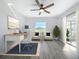 Bright office space with a ceiling fan, modern decor, and large windows offering plenty of natural light at 142 Broadmoor Ln, Rotonda West, FL 33947
