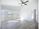 Bright living area with large bay windows and plenty of natural light at 142 Broadmoor Ln, Rotonda West, FL 33947