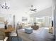 Comfortable living room with ceiling fan, stylish decor, and a relaxed atmosphere at 142 Broadmoor Ln, Rotonda West, FL 33947
