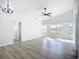 Large, open living space with high ceilings, a ceiling fan, and lots of natural light at 142 Broadmoor Ln, Rotonda West, FL 33947