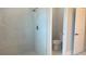 Walk-in shower and toilet in this spacious bathroom at 1495 Craleigh St, North Port, FL 34288