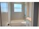 Bathroom with a shower-tub combo at 1495 Craleigh St, North Port, FL 34288