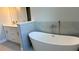 Bathroom featuring a soaking tub and a vanity at 1495 Craleigh St, North Port, FL 34288
