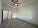 Large bedroom featuring wood-look flooring, ceiling fan and recessed lights at 1495 Craleigh St, North Port, FL 34288