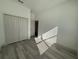 Bedroom with wood-look floors and a closet at 1495 Craleigh St, North Port, FL 34288