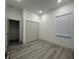 Bedroom featuring wood-look flooring, natural light, and a closet at 1495 Craleigh St, North Port, FL 34288