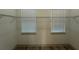 Walk-in closet with two windows and wire shelving at 1495 Craleigh St, North Port, FL 34288