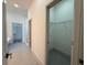 Hallway with a walk-in closet and bathroom at 1495 Craleigh St, North Port, FL 34288