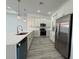 Well-equipped kitchen with stainless steel appliances, sleek countertops, and ample cabinet space at 1495 Craleigh St, North Port, FL 34288