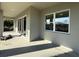 Covered patio featuring windows, and sliding glass doors, offering outdoor living space at 1495 Craleigh St, North Port, FL 34288