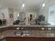 Kitchen view showcasing granite countertops and stainless steel sink overlooking the living area, great for entertaining at 1884 Coconut Palm Cir, North Port, FL 34288