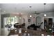Spacious kitchen view with granite countertops, stainless steel sink and view of the dining and living areas at 1884 Coconut Palm Cir, North Port, FL 34288