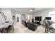 Spacious living room features a ceiling fan, tile floors, and an open layout perfect for entertaining and relaxing at 1884 Coconut Palm Cir, North Port, FL 34288