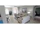 Open-concept living space with neutral colors, stylish furniture, and a seamless flow at 1884 Coconut Palm Cir, North Port, FL 34288