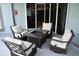 Inviting patio with cozy seating and fire pit, ideal for enjoying the outdoors and open to kitchen at 1884 Coconut Palm Cir, North Port, FL 34288