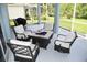 Relaxing outdoor patio with comfortable seating and a modern fire pit for cozy evenings at 1884 Coconut Palm Cir, North Port, FL 34288