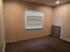 Small bedroom with neutral carpet and a window with blinds at 2308 18Th E St, Bradenton, FL 34208