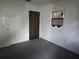 Bedroom with gray carpet, window with dark curtain and a closet at 2308 18Th E St, Bradenton, FL 34208