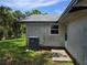 Exterior view of the home, showcasing an air conditioner and vinyl siding at 2308 18Th E St, Bradenton, FL 34208