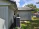Exterior view of the home, showcasing an air conditioner and vinyl siding at 2308 18Th E St, Bradenton, FL 34208