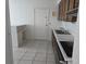 This kitchen features tile floors, neutral countertops, and plenty of room for customization at 2308 18Th E St, Bradenton, FL 34208