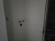 Close-up of a wall with electrical outlets and plumbing at 2308 18Th E St, Bradenton, FL 34208