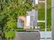 Birds eye view of the property showcasing lush landscaping, the backyard patio, and the roof at 2710 W North A St, Tampa, FL 33609