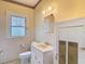 Bathroom featuring a white vanity, a mirror, and tiled walls at 2710 W North A St, Tampa, FL 33609