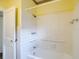 Clean bathroom with a tiled shower featuring grab bars and a shower head at 2710 W North A St, Tampa, FL 33609