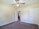 Cozy bedroom with warm paint featuring two entry ways and a ceiling fan at 2710 W North A St, Tampa, FL 33609