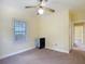 Cozy bedroom features warm, neutral color palette, window and ceiling fan at 2710 W North A St, Tampa, FL 33609