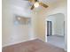 View of the dining area showing textured walls, a ceiling fan, and a view to other rooms at 2710 W North A St, Tampa, FL 33609