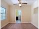 Cozy living room with a ceiling fan and a view into the adjacent kitchen, offering a glimpse of modern appliances at 2710 W North A St, Tampa, FL 33609