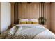 Cozy bedroom featuring a wooden headboard, and soft bedding at 16459 Hillsborough Blvd, Port Charlotte, FL 33954